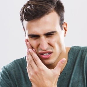 Treat jaw pain naturally by taking calcium rich food & massage jaw pain